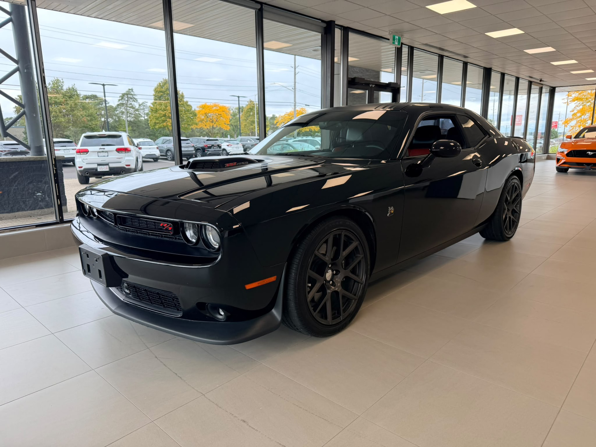 Black Dodge Challenger displayed in the Finch showroom